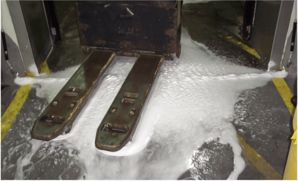 Forklift with foam on the floor.